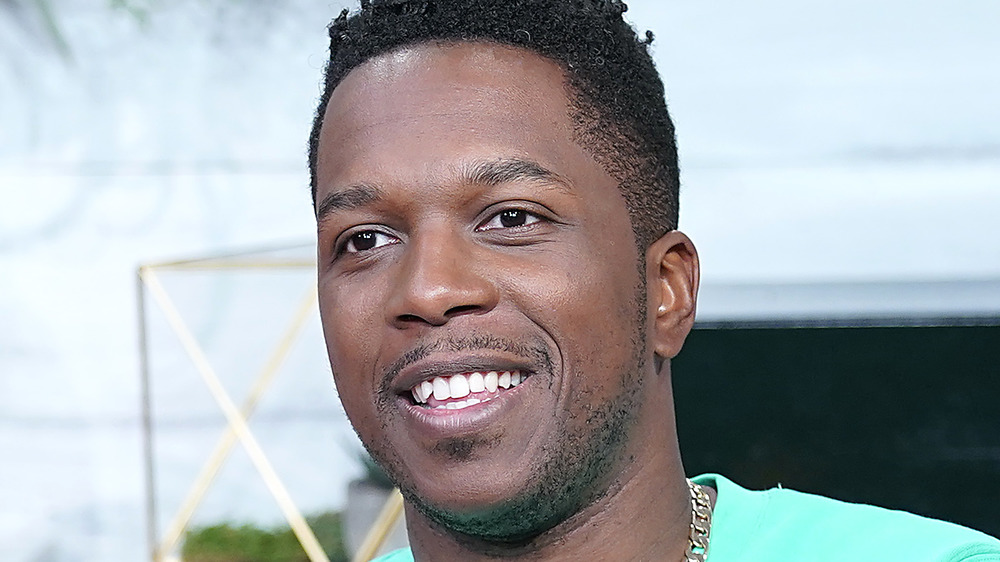 Leslie Odom Jr. smiling during an interview