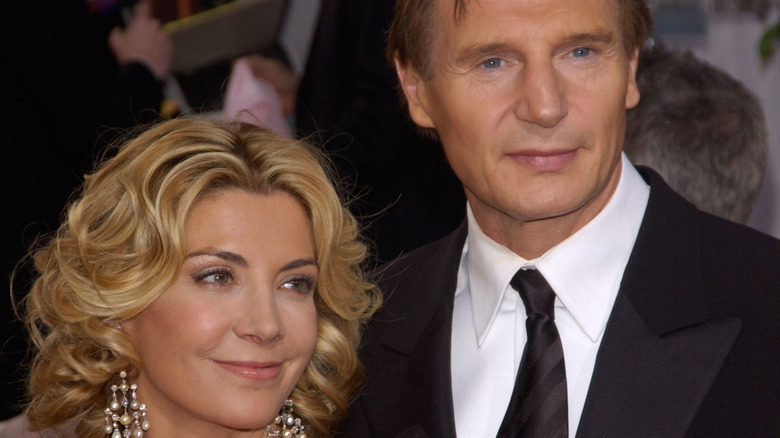 Natasha Richardson and Liam Neeson posing  