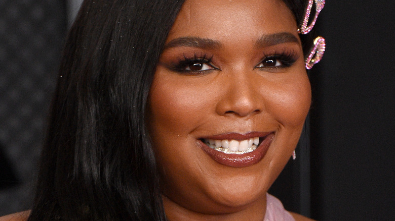 Lizzo smiling on the red carpet