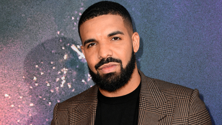 Drake wearing a suit