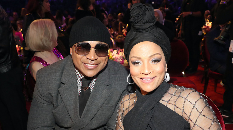 LL Cool J and Simone Smith seated at the 65th Grammy Awards
