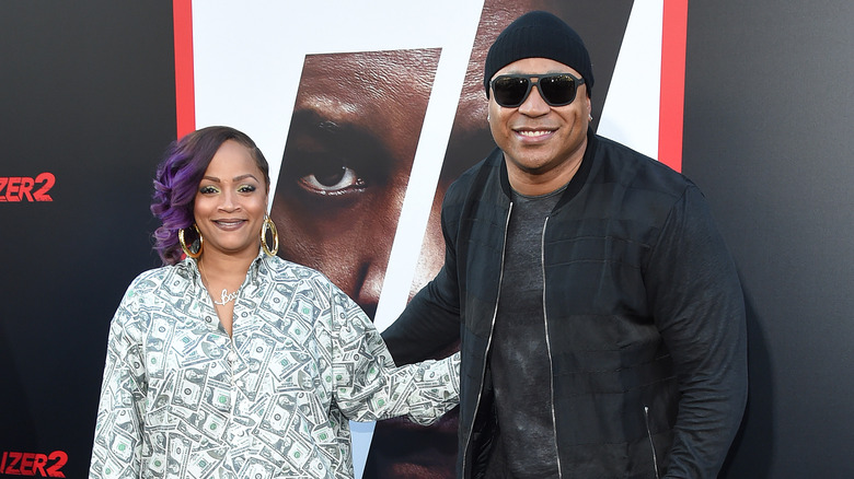 LL Cool J and Simone Smith smiling and placing hands on each other's backs