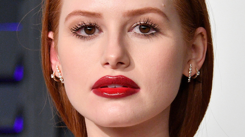 Madelaine Petsch red lipstick diamond earrings