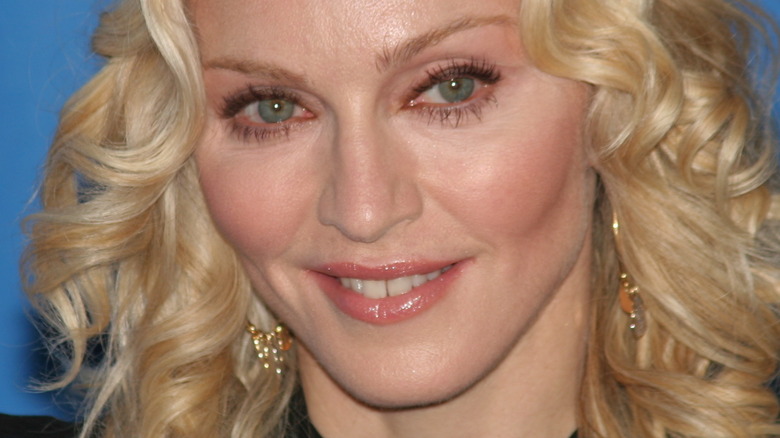 Madonna smiles blue background