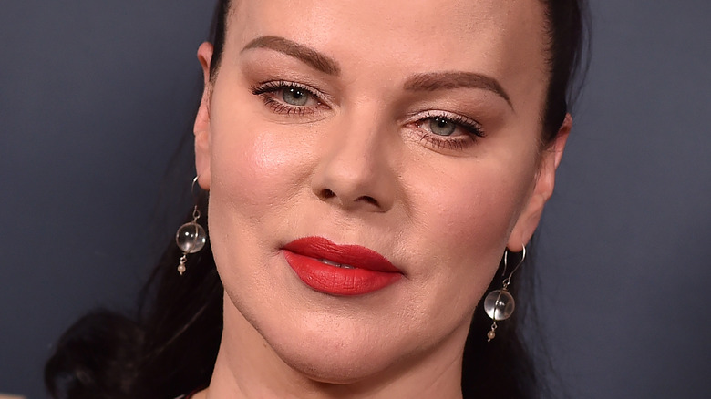 Debi Mazar wears red lipstick