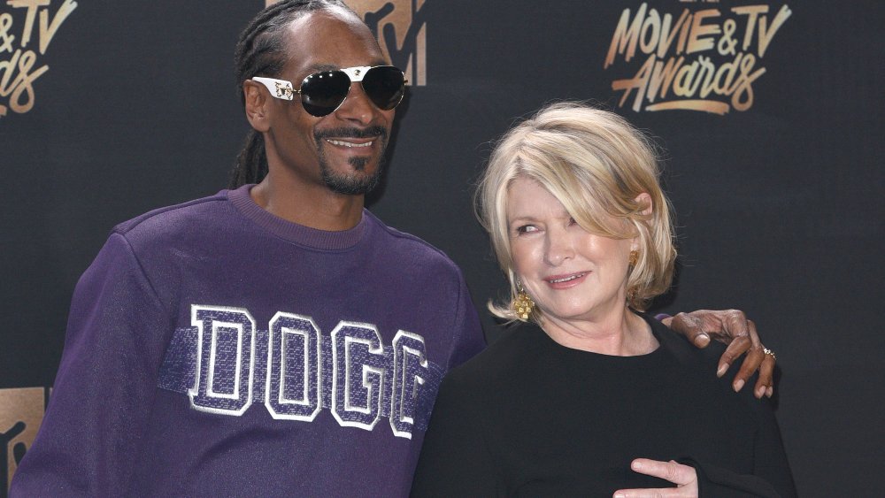 Snoop Dogg and Martha Stewart smiling and posing together on the red carpet