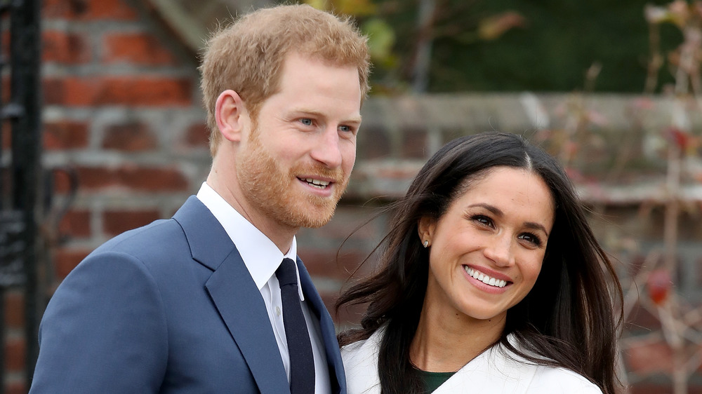 Prince Harry Meghan Markle posing for cameras