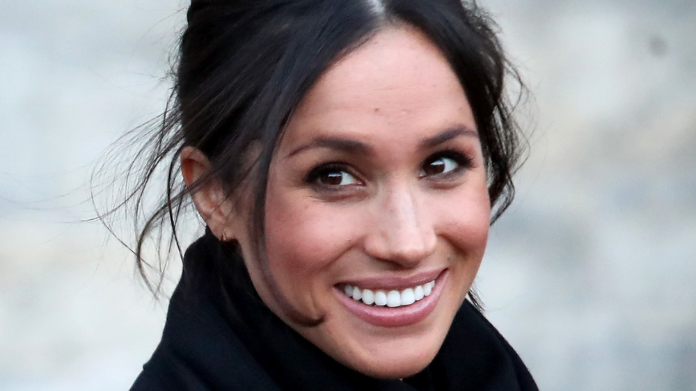 Meghan Markle smiling for the cameras
