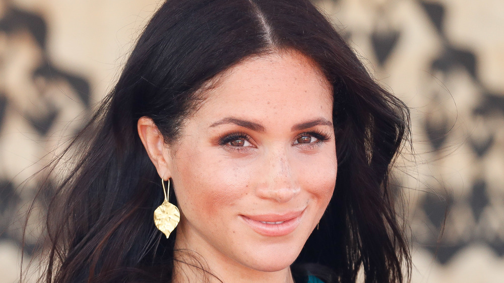 Meghan Markle smiling at an event