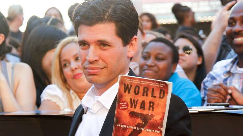 Max Brooks holding book