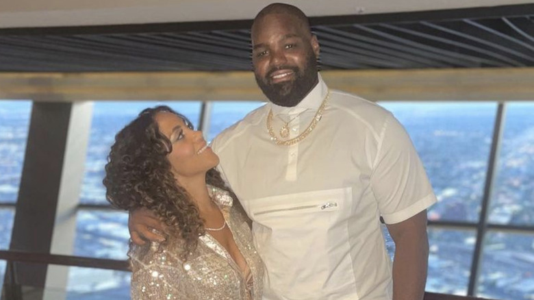 Tiffany Roy looking up at Michael Oher