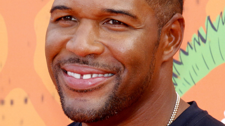 Michael Strahan smiling at an event