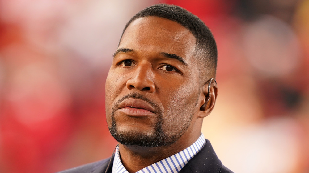 Michael Strahan with a serious expression