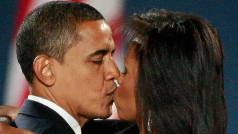 Michelle and Barack Obama kissing