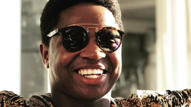 Mzi 'Zee' Dempers, wearing sunglasses, smiling, 2019 photo