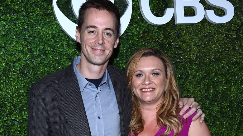 Sean Murray and Carrie James smile at an event