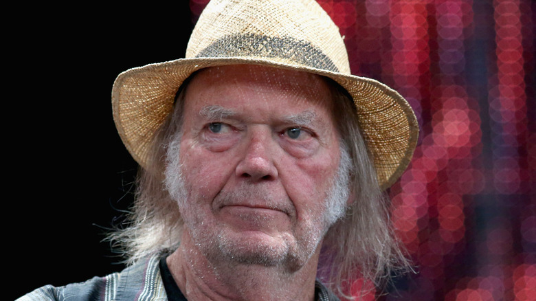 Neil Young long grey hair straw hat