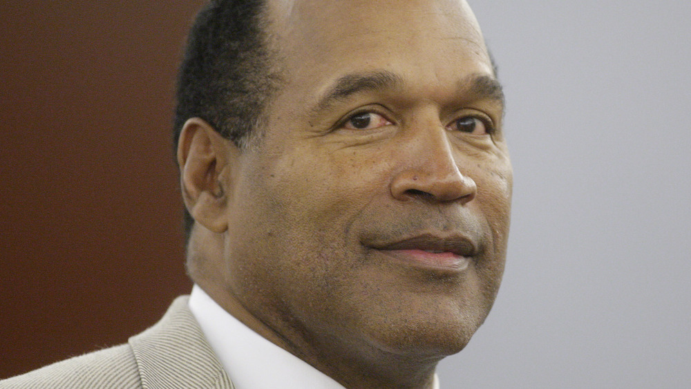 O.J. Simpson wearing a tan suit in court