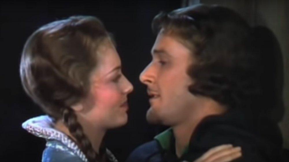 Olivia de Havilland, Errol Flynn acting opposite one another