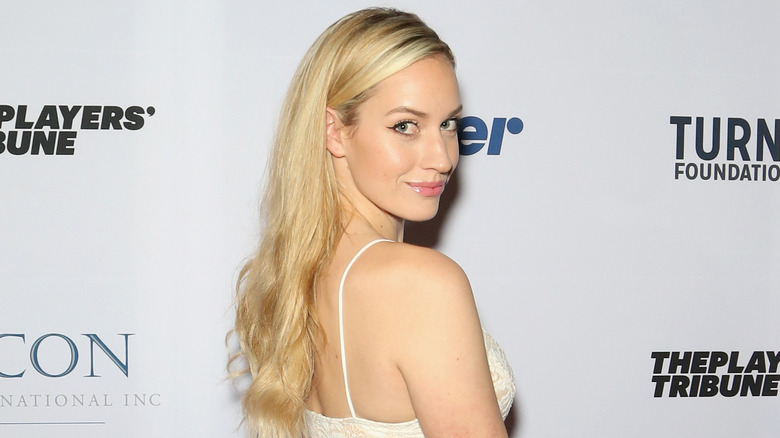 Paige Spiranac looking over her shoulder 