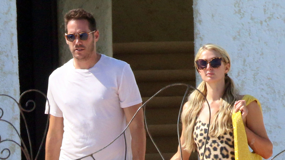 Paris Hilton and Carter Reum walking