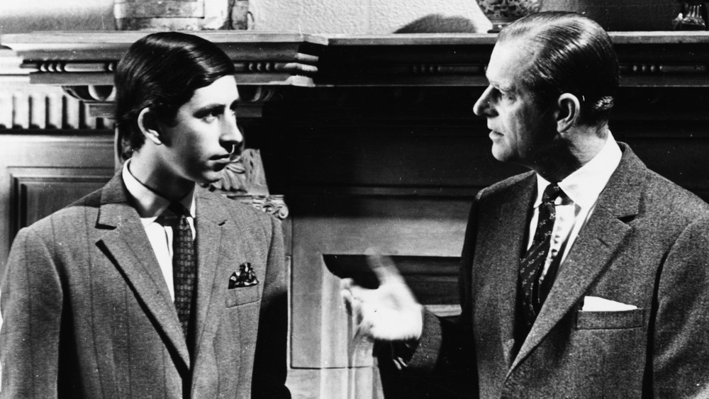 Prince Charles and Prince Philip speaking in 1969