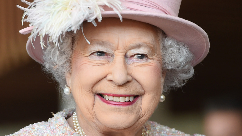 Queen Elizabeth, smiling, wearing a hat, 2017 photo