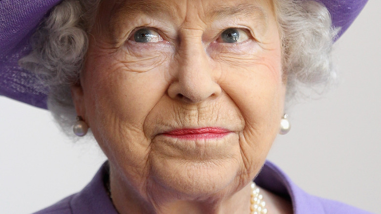 Queen Elizabeth looking to the side with slight smirk