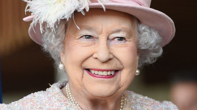 Queen Elizabeth smiles at an engagement