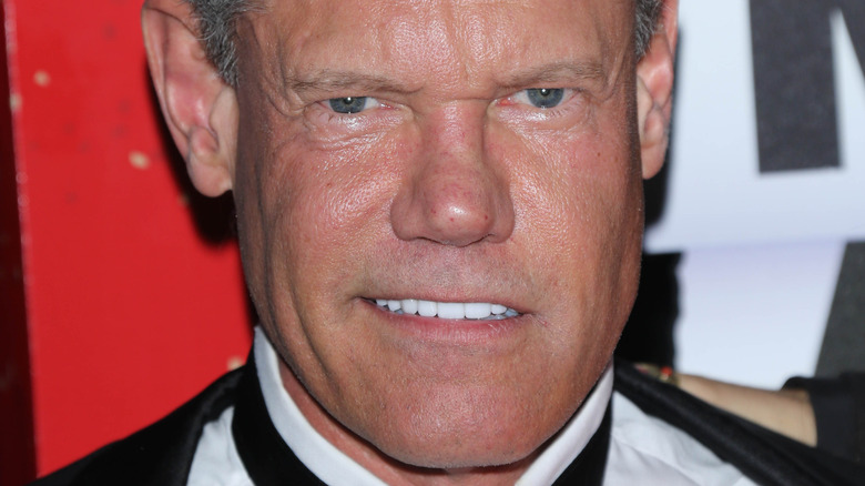 Randy Travis smiling in a tux.