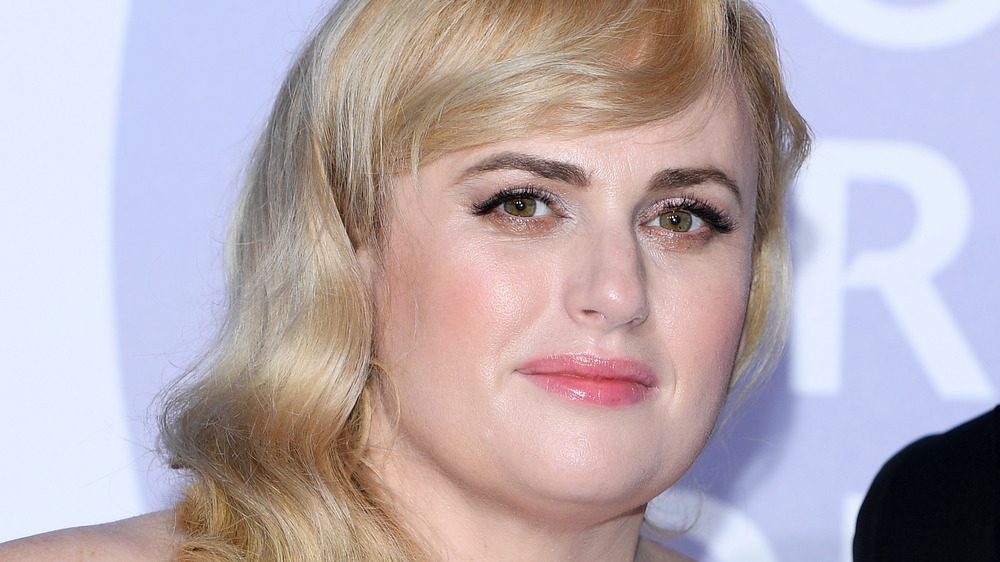 Rebel Wilson looking serious on the red carpet