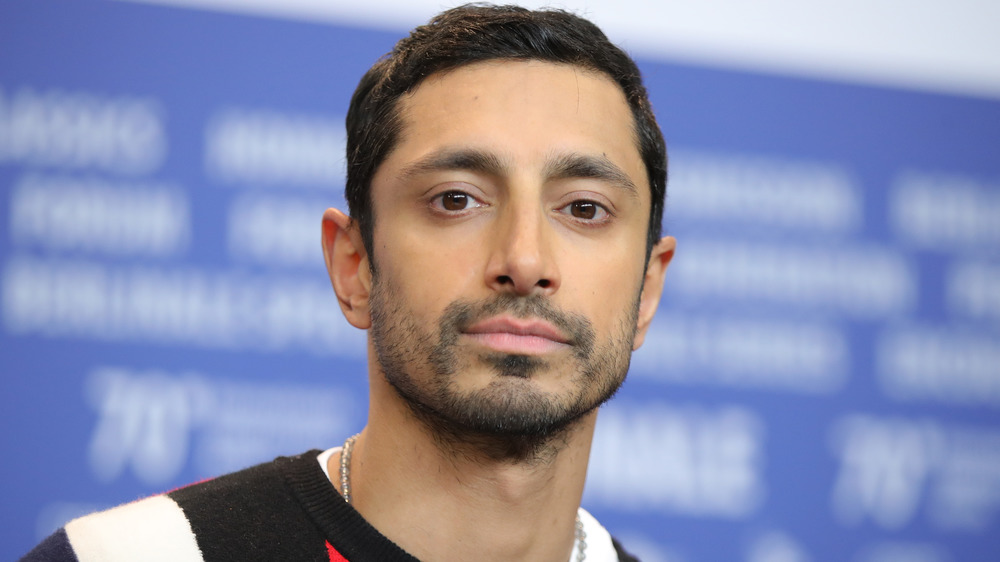 Riz Ahmed staring at the camera