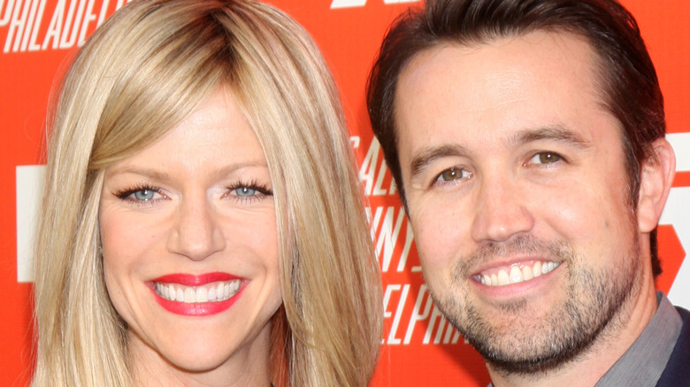 Rob McElhenney and Kaitlin Olson smiling in 2013