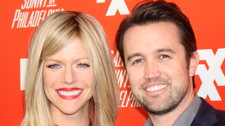 Rob McElhenney and Kaitlin Olson smiling in 2013