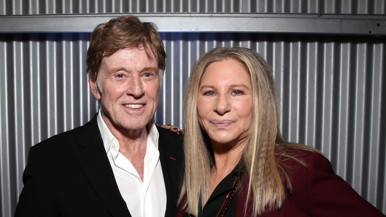 Robert Redford and Barbra Streisand posing