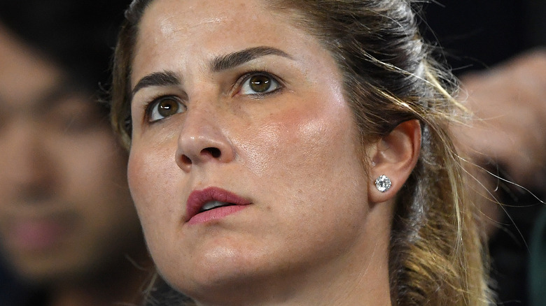 Mirka Federer watching tennis