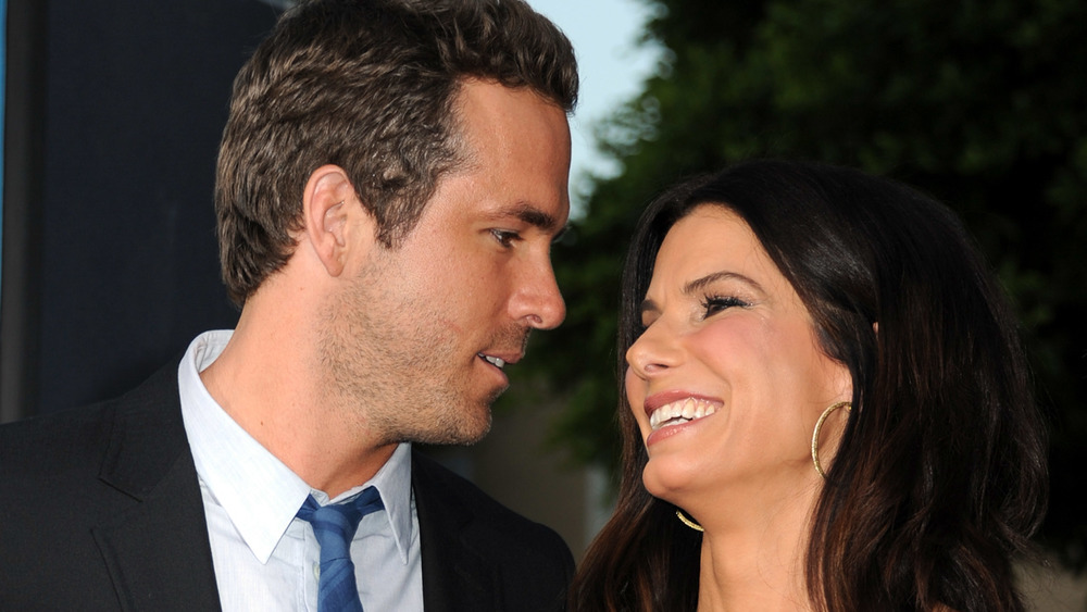 Sandra Bullock smiling Ryan Reynolds