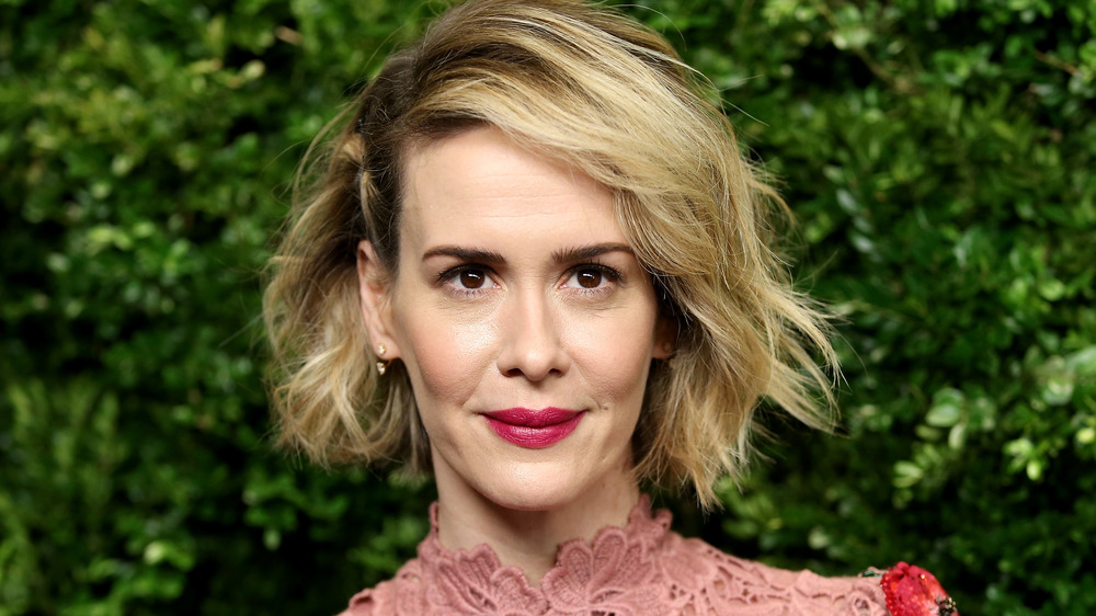 Sarah Paulson with short hair, dressed up, slightly smiling at a 2020 Vanity Fair party for the Oscars