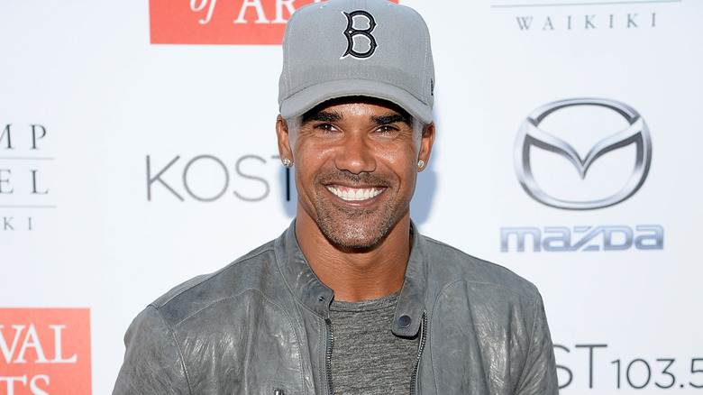 Shemar Moore with Boston Red Sox hat, smiling