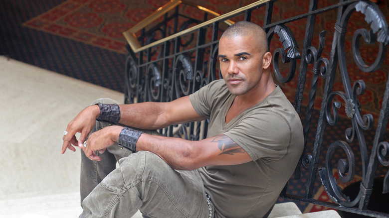Shemar Moore sitting on staircase