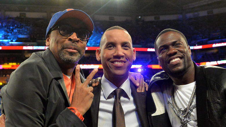 Spike Lee and Reggie Miller taking a photo with Kevin Hart