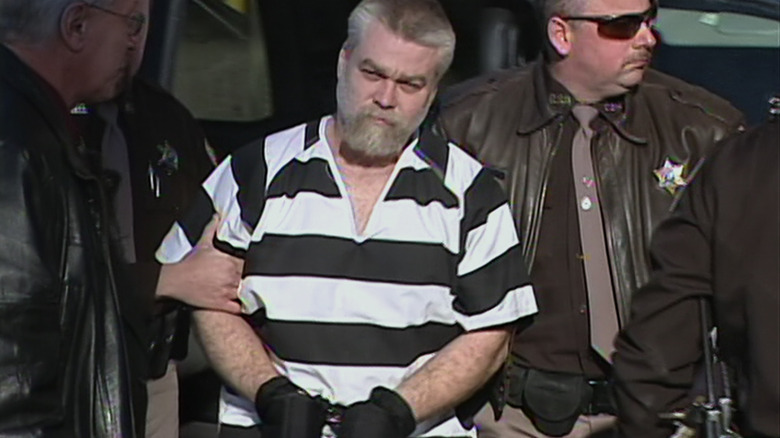 Steven Avery handcuffed being escorted by authorities.
