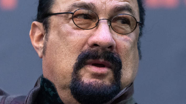 Steven Seagal with goatee and glasses