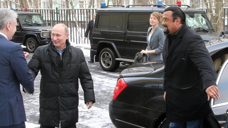 Steven Seagal with Vladimir Putin exiting car in Moscow
