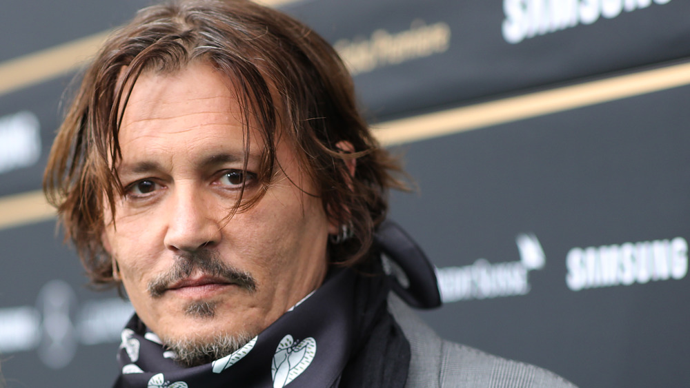 Johnny Depp wearing a scarf