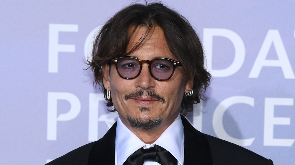 Johnny Depp poses at an event
