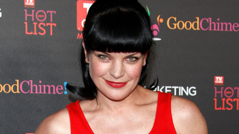 Pauley Perrette smiling in red tank top