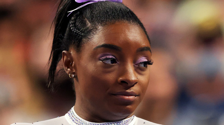 Simone Biles looking to side during competition