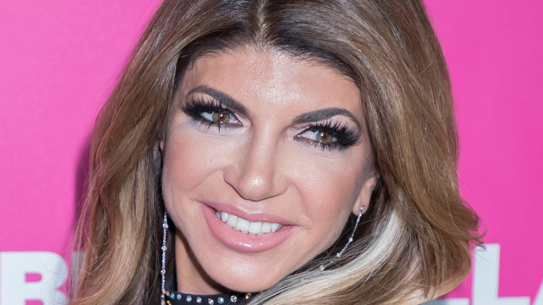 Teresa Giudice close up with pink background