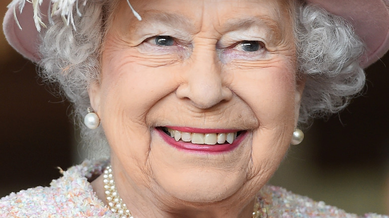 Queen Elizabeth II smiling at an event 